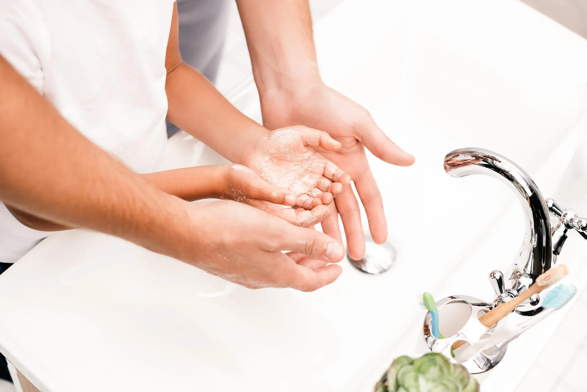 Father and son washing hands